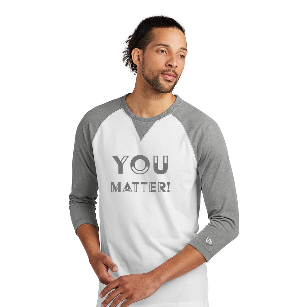 Gray and white long sleeve shirt with text applied to the front of the shirt.