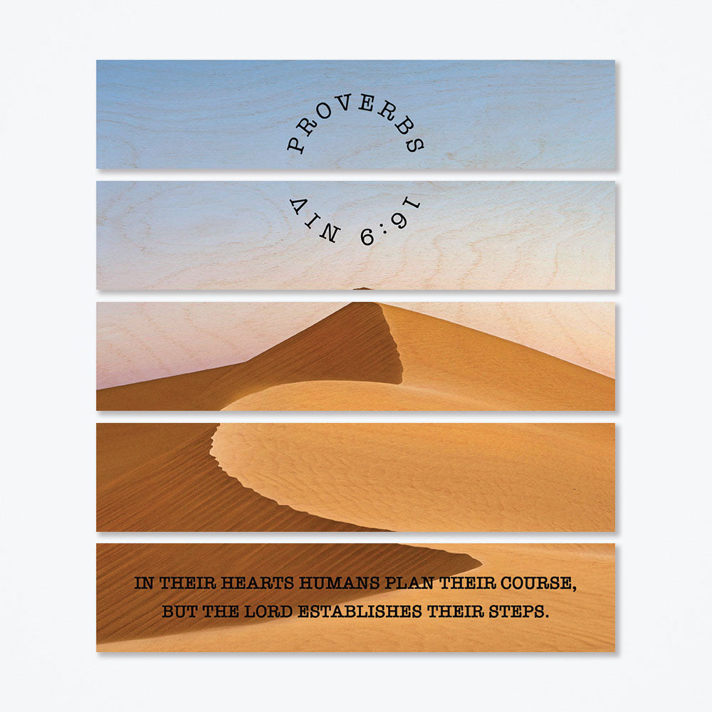 A multi panel wood poster with a sandy desert print.