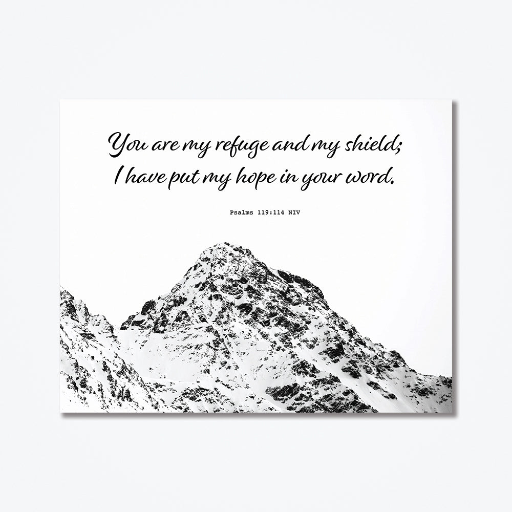 This metal poster has a mountain top as well as black text at the top.