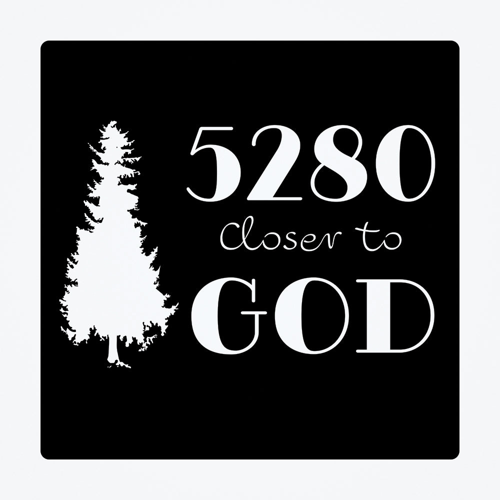 A wall sticker with a black background and a silhouette of a white tree.