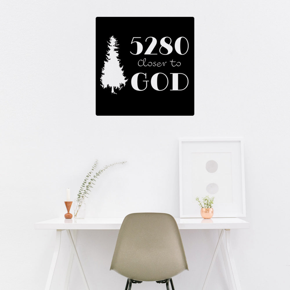 Mockup of a black background sticker with a white silhouette of a tree.