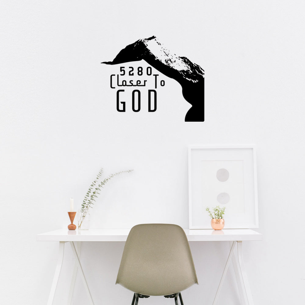 Wall sticker of a black and white mountain mocked up for your home office.